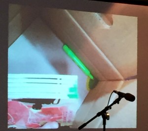 Open highlighter in box with stained books